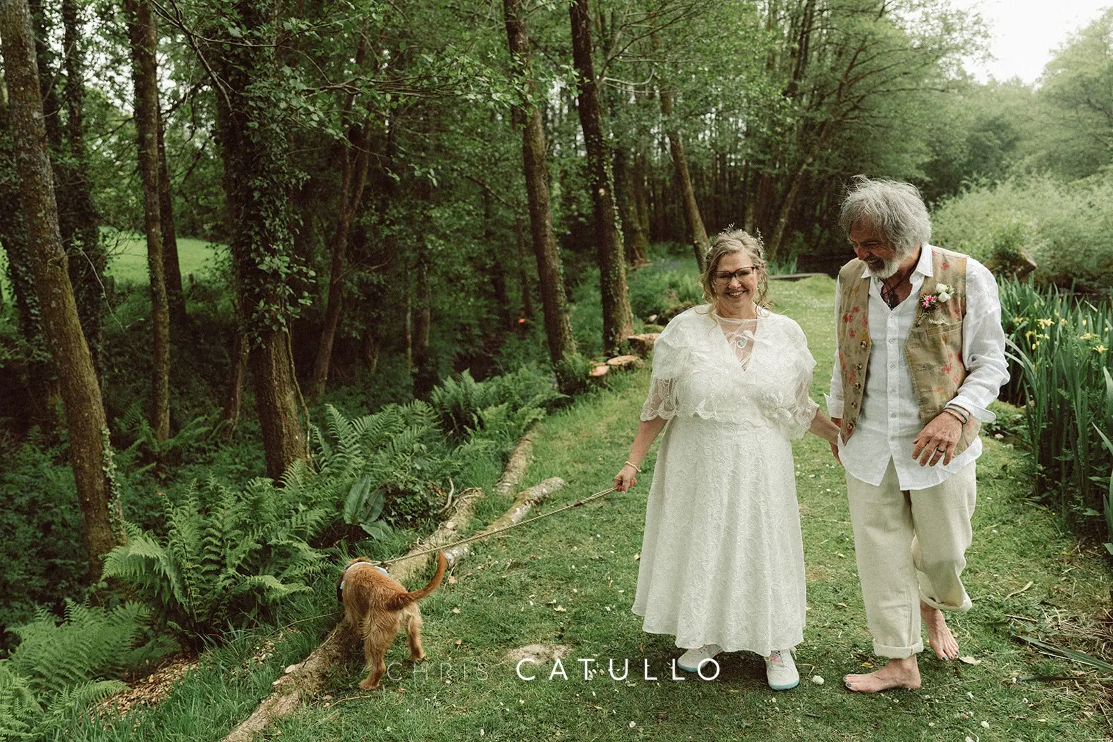 Chico the dog wearing his decorated collar at Emma and René's wedding