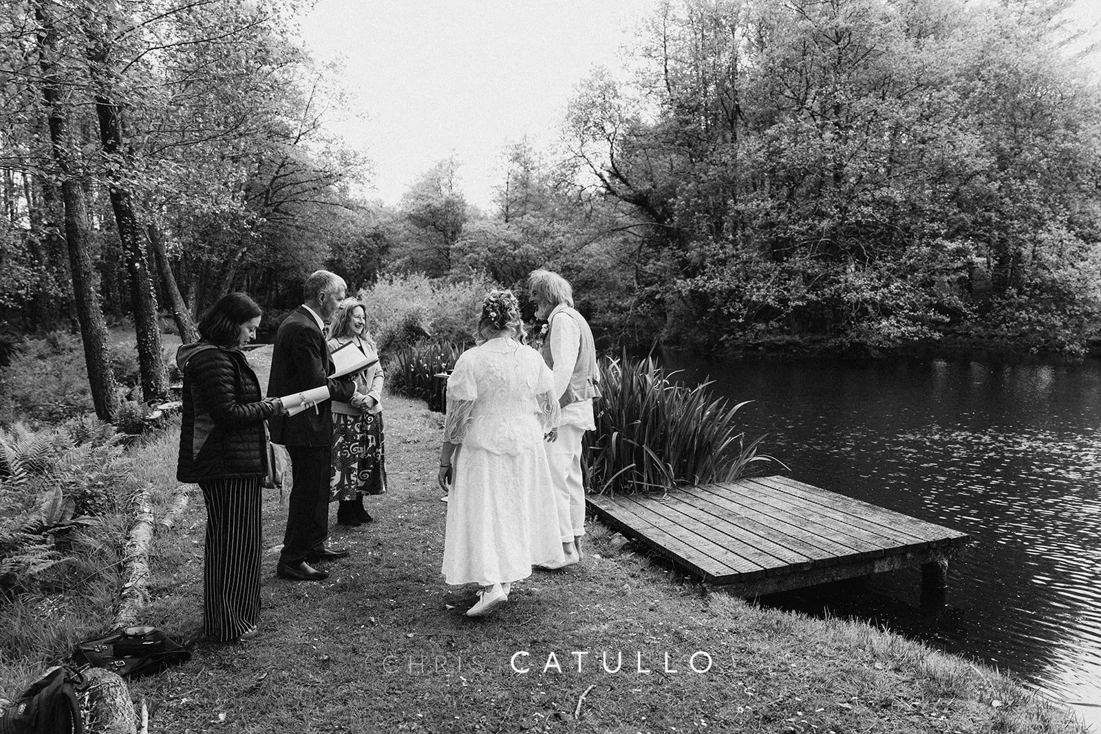 Emma and René's lakeside wedding ceremony at Tree Top Escape, surrounded by birdsong