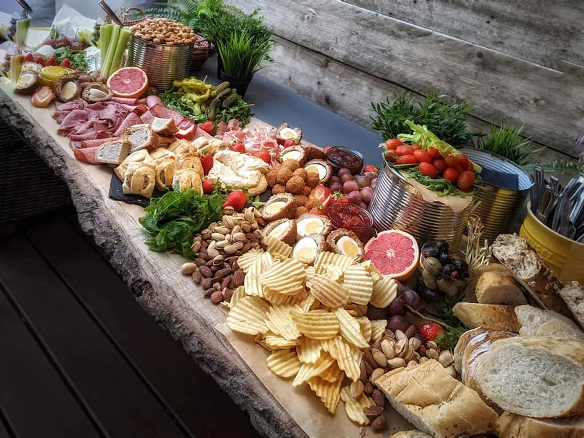 A Frisky Pheasant artisan grazing board laid out for a wedding at Tree Top Escape