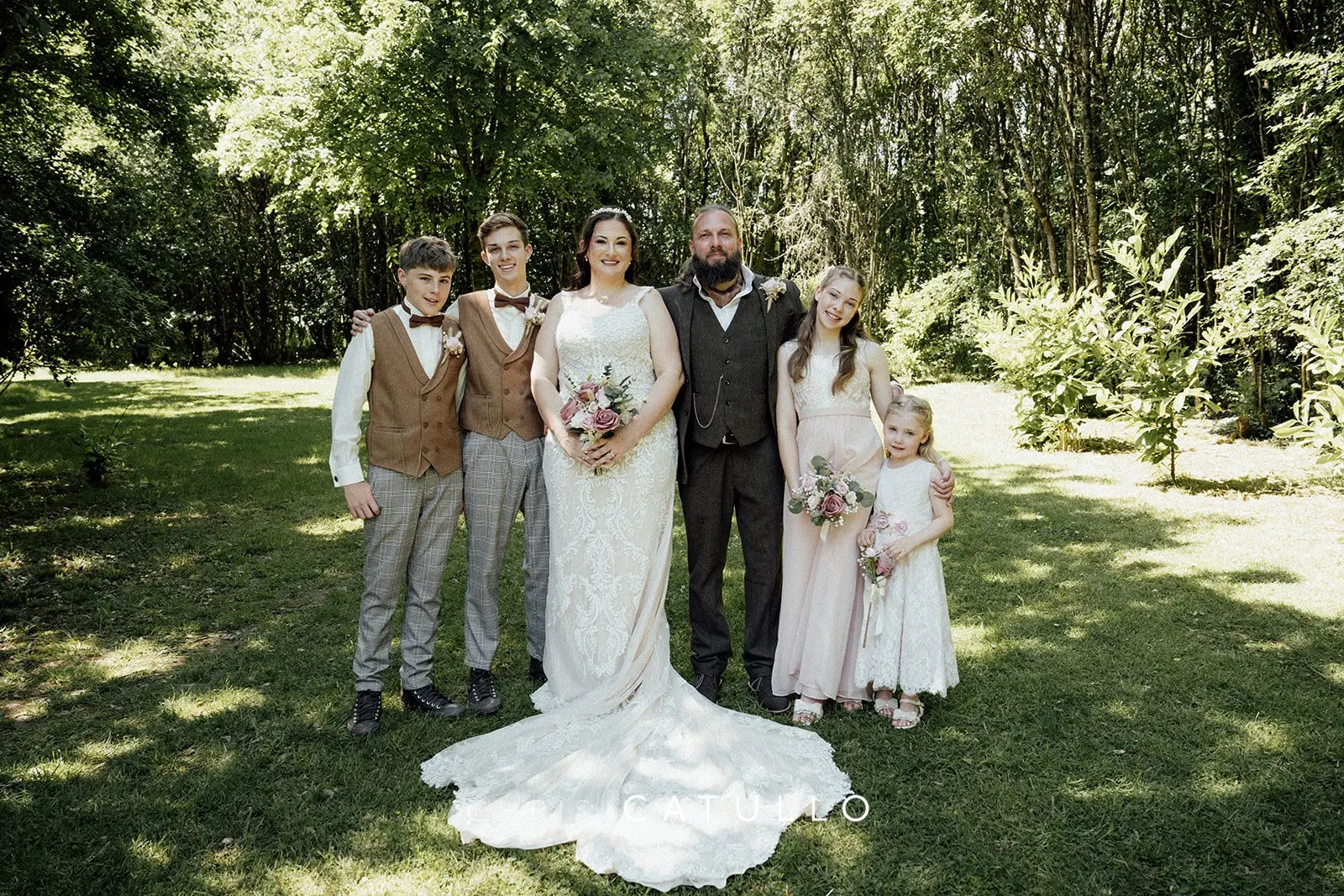 Kelly and Dave's blended family wedding portrait with their four children at Tree Top Escape, North Devon